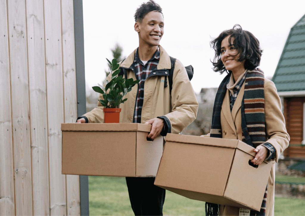 A young couple moving boxes